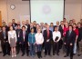 UMSL Chancellor Tom George (center, red tie) stands with the inaugural class of UMSL faculty, staff and students inducted into the new campus chapter of the National Academy of Inventors. (Photo by August Jennewein)