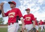 lois_standefer_495_278 Justin Lois (left) and Drew Standefer congratulate teammates after a recent win. The UMSL Tritons baseball team posted a 4-1 record last week (Photo by Danny Reise)