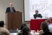 UMSL Chancellor Tom George delivers welcoming remarks at the 12th annual Cambio de Colores (Change of Colors) Conference at the university. Looking on is Domingo Martínez Castilla, director of Cambio Center at MU, which sponsors the event. (Photo by August Jennewein)