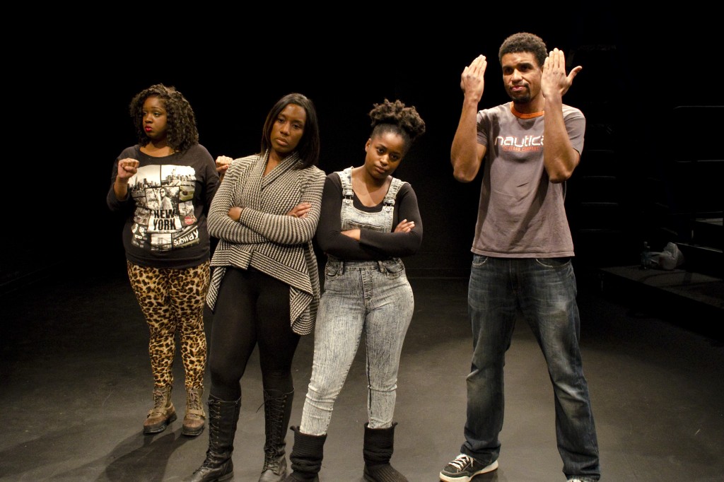 From left, UMSL student Tiffany Knighten, Professor Jacqueline Thompson, student Kenyata Tatum and St. Louis actor Reginald Pierre participate in an exercise during the Theatre of the Oppressed workshop at the Kranzberg Art Center. (Photo by Michael B. Perkins.)