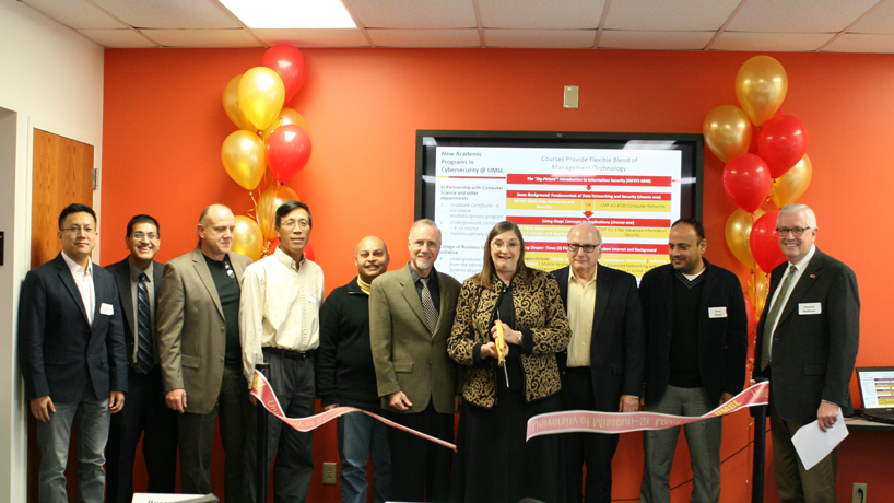 UMSL’s Cybersecurity Lab opened Nov. 13 on the second floor of Express Scripts Hall. The lab is a collaboration between the Department of Information Systems and Department of Math and Computer Science. Pictured (from left) are  Jianli Pan, Dinesh Mirchandani, Cezary Janikow, Haiyan Cai, Sanjiv Bhatia, Chancellor Tom George, Provost Glen Cope, Dean Ron Yasbin, Shaji Khan and Dean Charles Hoffman. (Photo by Jen Hatton)
