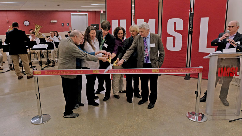 (From left to right) Chancellor Tom George, Department of Physics and Astronomy Chair Erika Gibb, Department of Biology Chair Wendy Olivas, Department of Chemistry Chair Cynthia Dupureur, Associate Professor of Biology Bethany Zolman, Associate Dean of the College of Arts and Sciences Teresa Thiel and Interim Provost Chris Spilling cut the ribbon for the grand opening of the Science Learning Building at UMSL as Dean of the College of Arts and Sciences Ron Yasbin pronounces the building officially open. (Photos by August Jennewein)