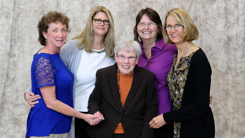 Professor Emerita of Chemistry Jane Miller (center) stands with former students and UMSL alumnae (from left) Jeanette Hencken, Liz Petersen, Sandra Mueller and Joan Twillman. The women credit Miller with inspiring them to pursue careers in science education and instill their passion for science and women empowerment in generations of St. Louis youth. (Photo by August Jennewein)