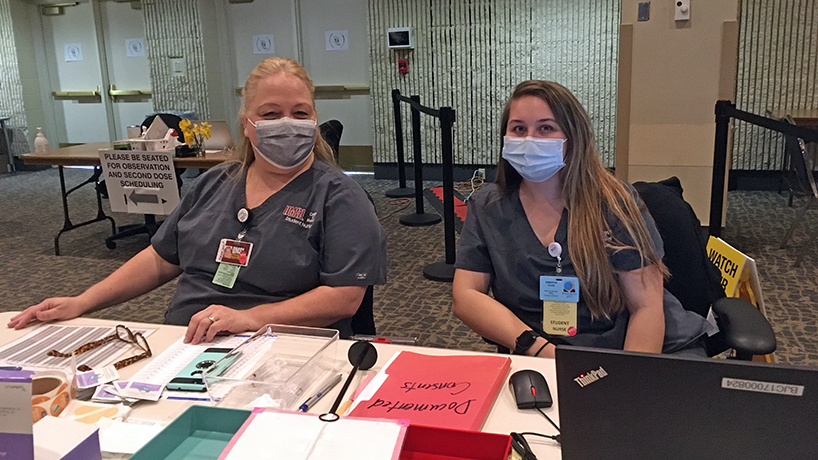 From left: UMSL College of Nursing students Tanya McLaughlin and Sam Gockel are among the 10 student nurses who gave vaccines at Christian Hospital on April 7. Every UMSL BSN student has done at least three shifts this semester administering vaccines.