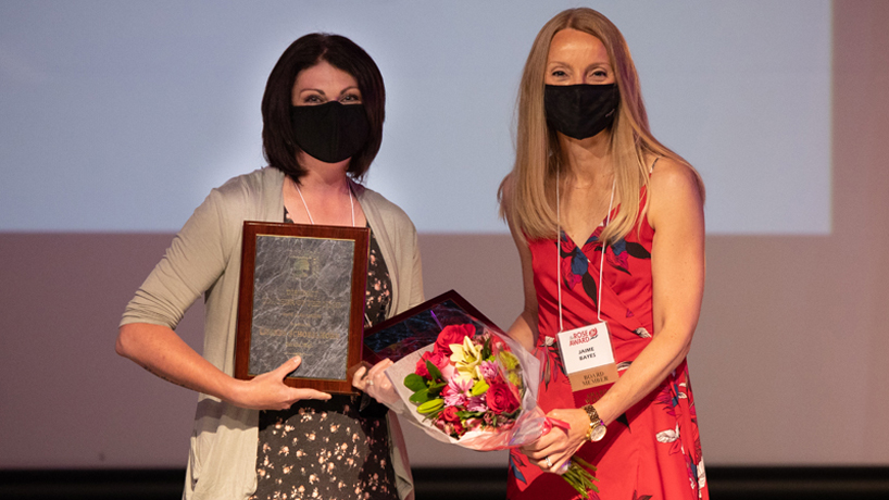 Lauren Schoellhorn accepts an award for district teacher of the year