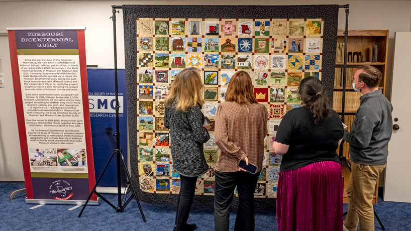 People view the Missouri Bicentennial Quilt on display in the State Historical Society of Missouri Research Center in UMSL's Thomas Jefferson Library