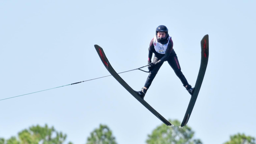 Lauren Morgan soars through the air on water skis after a jump