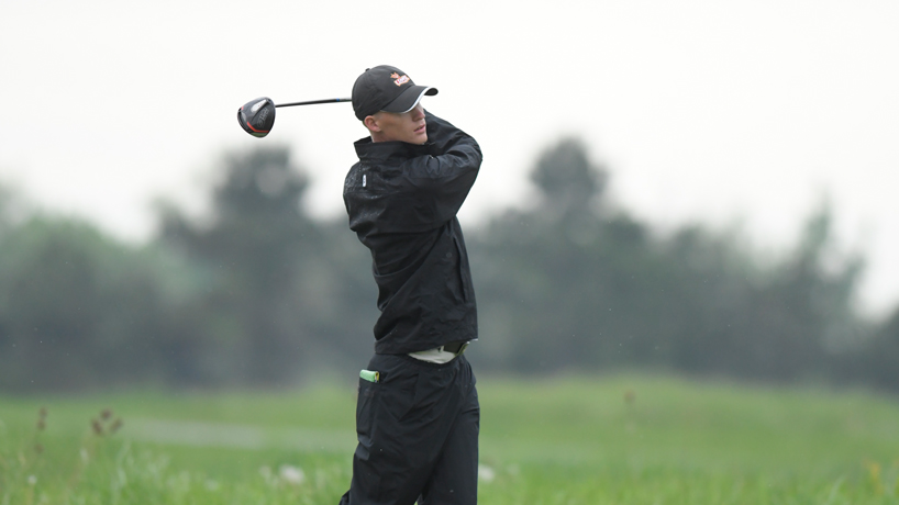 Men's golfer Joel Sylven finishes his swing