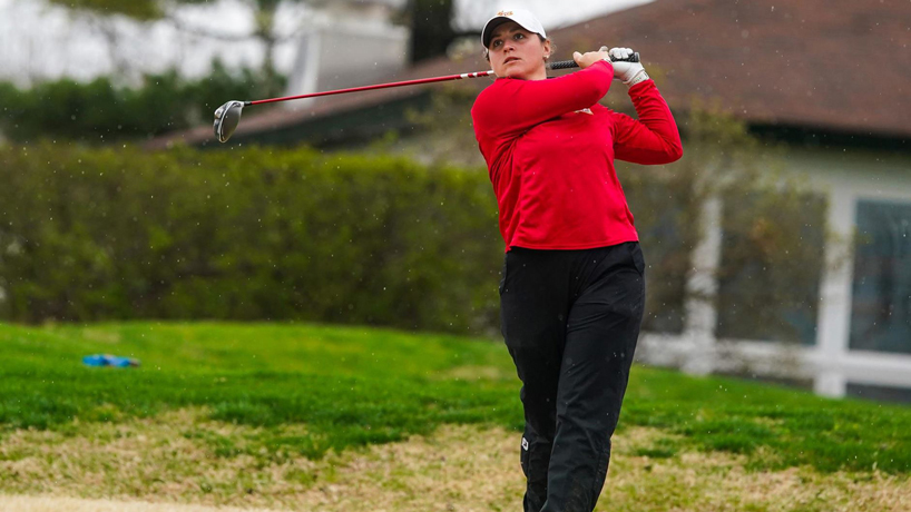 UMSL golfer Manon Labeur completes her swing