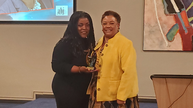 KMOX Radio host Carol Daniel presents Adella Jones with a Greater St. Louis Association of Black Journalists Living Legend award