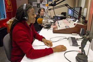 LaVell Monger, a junior biology major and president of SEMPA at UMSL, sits in with Melissa Lesniak, a DJ at The U