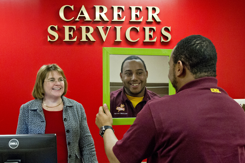 Teresa Balestreri, director of Career Services at the University of Missouri–St. Louis, talks with Christopher Williams, a graduate student in education