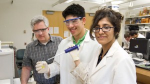 Professor of Chemistry Keith Stine (left) oversees 2013 STARS student Max Bernstein (MICDS) and his mentor Abeera Sharma (PhD chemistry 2014) as they test the materials and biochemical aspects of carbohydrates in Stine's lab at UMSL.