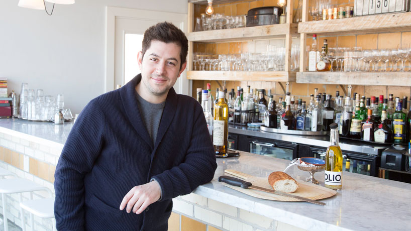 Chef and restaurant owner, Ben Poremba (BA 2013) is helping revitalize the Botanical Heights neighborhood in St. Louis with the four restaurants he opened on Tower Grove Avenue. (Photo by August Jennewein)