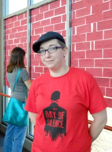 Natalie Smith, PRIZM president, silently stands in front of the red bricks on UMSL's Day of Silence in demonstration of discrimination.