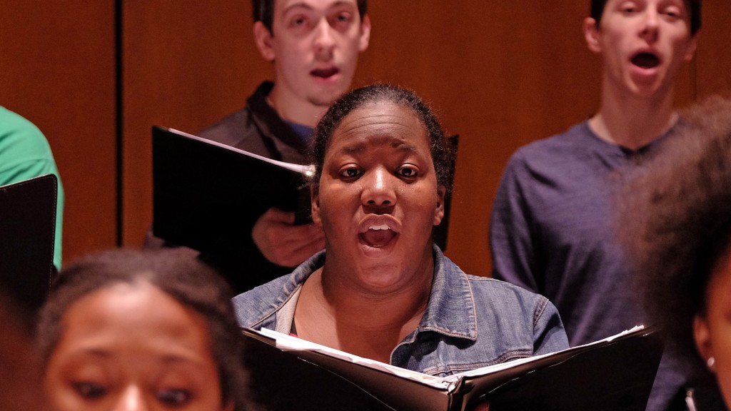 UMSL student Maria Ellis rehearses for a performance with the University Singers. (Photo by August Jennewein.)