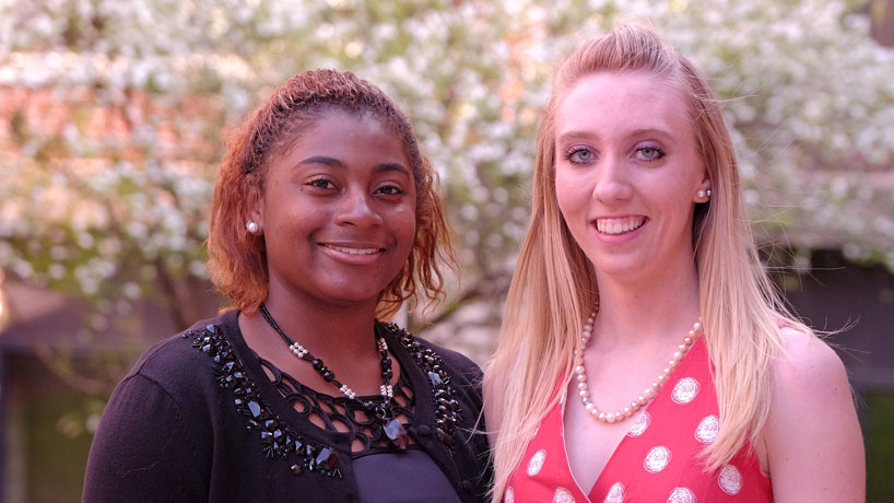 Briona Perry (left) and Elle Fitzpatrick are the first students to graduate from the Opportunity Scholars Program. They both earned bachelor's degrees in biology. (Photo by August Jennewein)