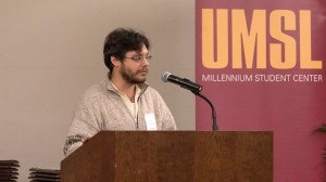 Christopher Alex Chablé, MFA student and 2015 UMSL poet laureate, reads to high school juniors at the annual Distinguished Achievement Awards for Science Excellence.