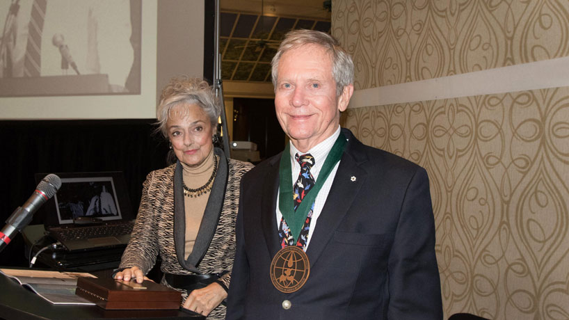 Anna Harris, 2015 World Ecology Gala co-chair for the Whitney R. Harris World Ecology Center at UMSL, and artist Robert Bateman pose moments after she presented him with the 2015 World Ecology Award on Saturday at the gala at the Saint Louis Zoo. (Photos by August Jennewein)