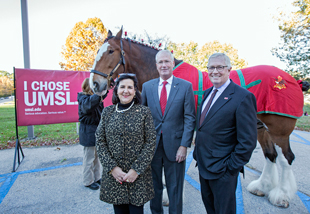 Curly the Clydesdale, Margarita Flores, vice president for community affairs at Anheuser-Busch; Rick Stream, alumnus and former state representative; and Dean Charlie Hoffman attended the groundbreaking for the new business building. (Photo by August Jennewein)