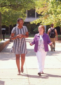 Alumnae Aleshia Patterson (left) and Norma Barr stroll campus as they discuss how the new, all-inclusive Alumni Association membership helps alumni connect to UMSL. (Photo by August Jennewein)