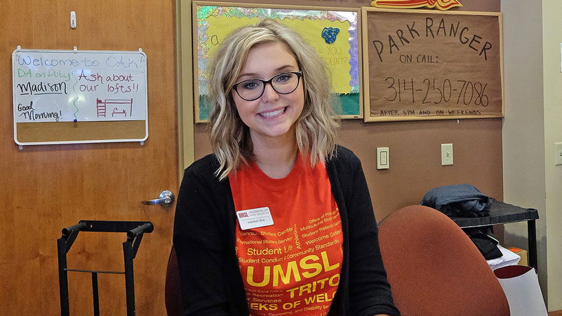BSN major Madison Bick works a shift at the front desk of Oak Hall. She concluded her freshman year at UMSL this spring with a 4.0 GPA and two campus awards including "Desk Assistant of the Year" and “Shining Star.” (Photo by August Jennewein)