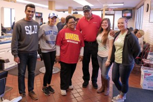 (From left) SLU students Suraj Arshanapally and Angela Dicosola, UMSL Community Health Nursing Assistant Professor Sheila Grigsby, 100 Black Men Health &amp; Wellness Division Leader Lennie Harrison, and UMSL students Amy Linck and Tamara Bennett lead a weekend's efforts for the Barbershop Tour at Womack's.