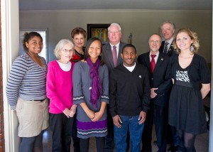 Eric'el Johnson (center in purple) attends an Opportunity Scholars Program event with Chancellor Tom George (red tie).