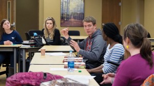 Recent graduate Cameron Roark speaks to students in Teaching Professor Kimberly Baldus' Pierre Laclede Honors College class. He made frequent visits as an honors college mentor, one of his many roles during his time at UMSL. (Photos by August Jennewein)