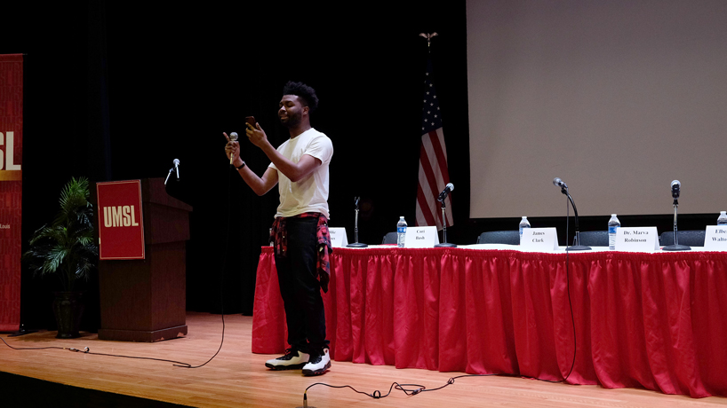Steven Smoote on stage at the J.C. Penney Auditorium