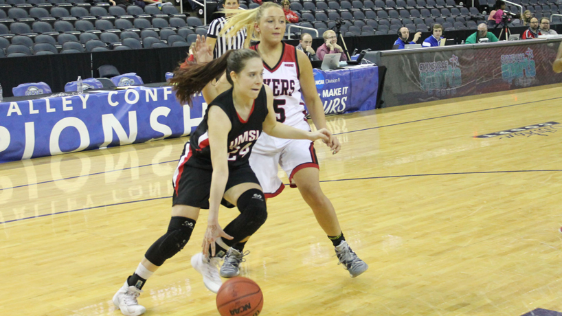 Laura Szorenyi attempts to dribble around a Lewis defender