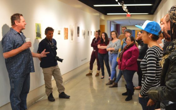 Jeff Sippel, guest artist and crowd during gallery talk