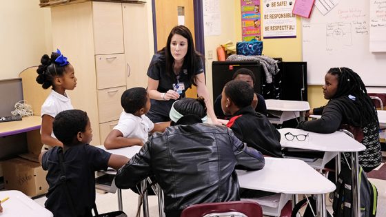 BSN student Skye Mitchell rallies her team for a round of Jeopardy! during a day of service learning at Barack Obama Elementary School. (Photos by August Jennewein)