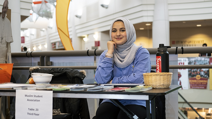 Muslim Student Association Vice President Dahlia Abdulsattar took the opportunity to plan an inter-organizational event during the expo. (Photo by Jessica Rogen) 