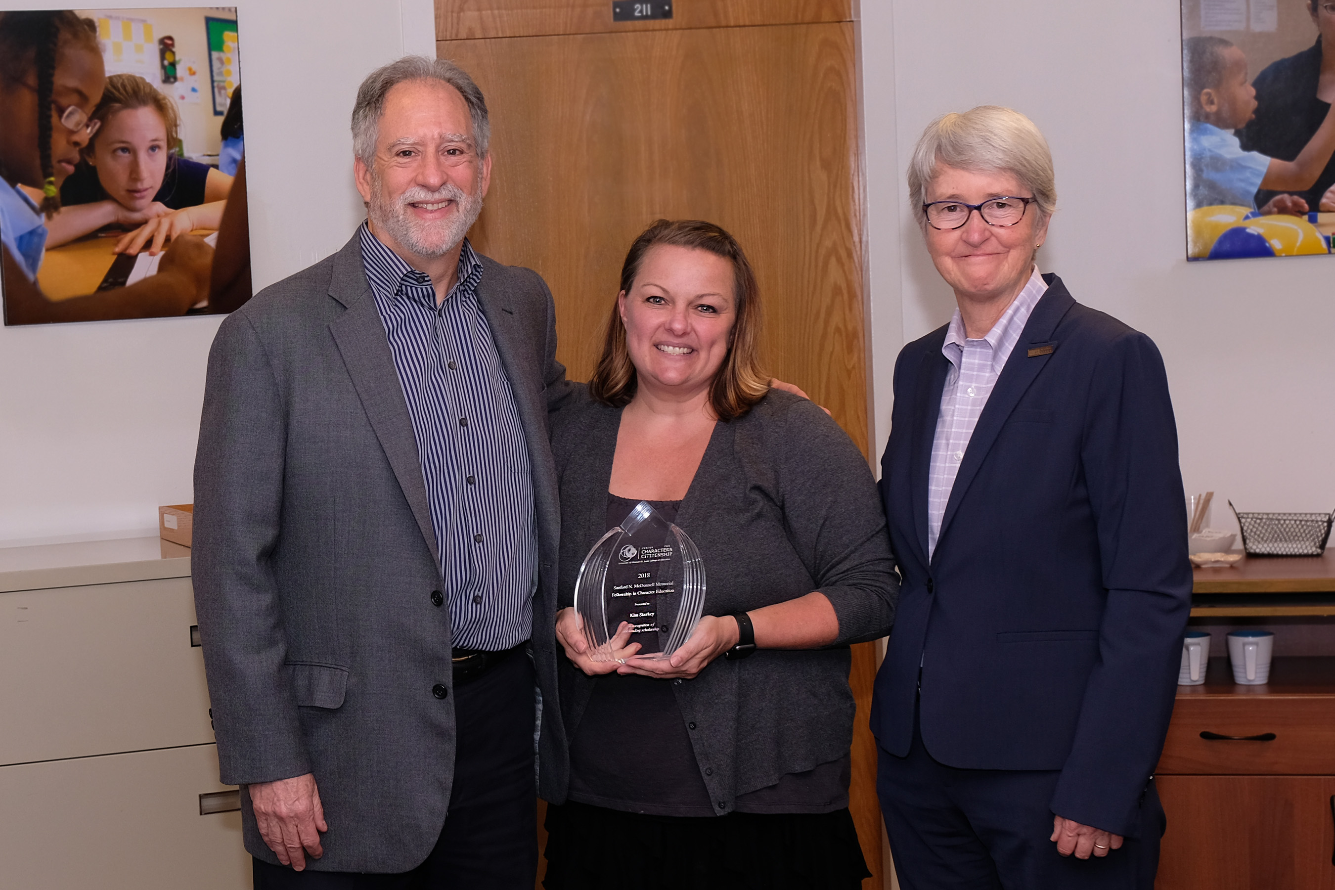 PhD student Kim Starkey earned the Sanford N. McDonnell Memorial Fellowship in Character Education, presented to her by Marvin Berkowitz and Ann Taylor.