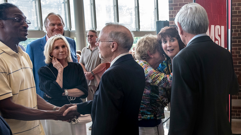 Hundreds gather to wish Chancellor Tom George and Barbara Harbach well in retirement