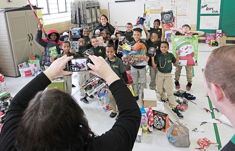 College of Optometry brings Christmas to south city charter school