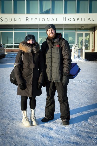 Marcy O’Neil (left) and George Dowdy stand in front of the eye clinic at Norton Sound Regional Hospital in Nome, Alaska. (Photo by Michael Burnett)