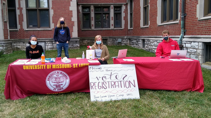 Students outside the Pierre Laclede Honors College wait to help fellow students register to vote