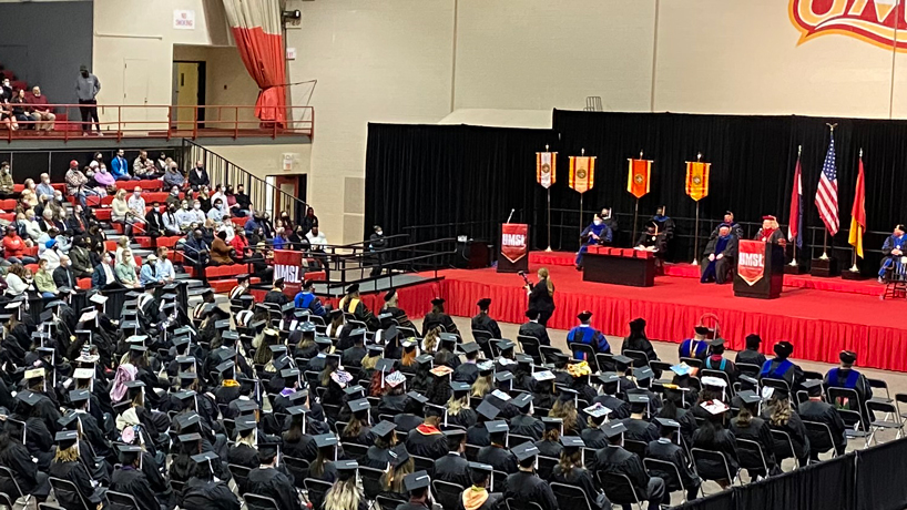 Chancellor Kristin Sobolik welcomes students to a commencement ceremony at the Mark Twain Athletic Center