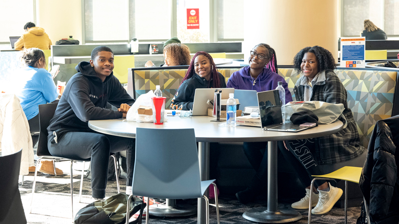 Sophomore pre-social work student Mia Foote enjoy lunch with three of her classmates in The Nosh