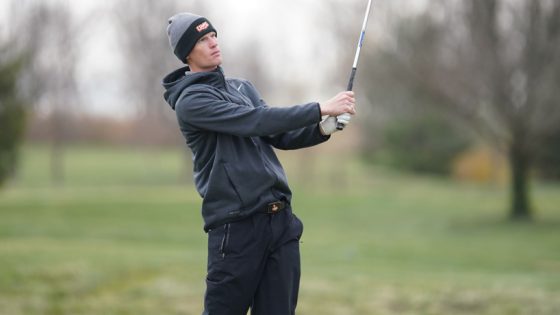 Joel Sylven stands and watches his shot at the Findlay Spring Invite