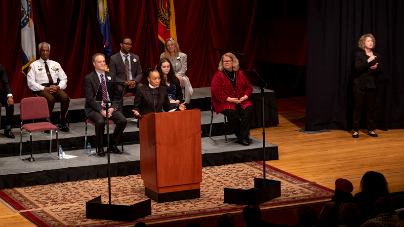 UMSL alumna Shawntelle Fisher delivers the invocation at the State of the County Address