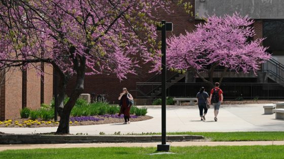 Students walk near the J.C. Penney Conference Center on a spring day