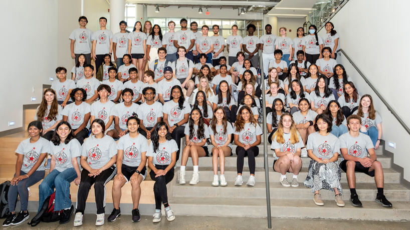 High school students participating in the 2022 STARS program gather on the steps of the Science Learning Building