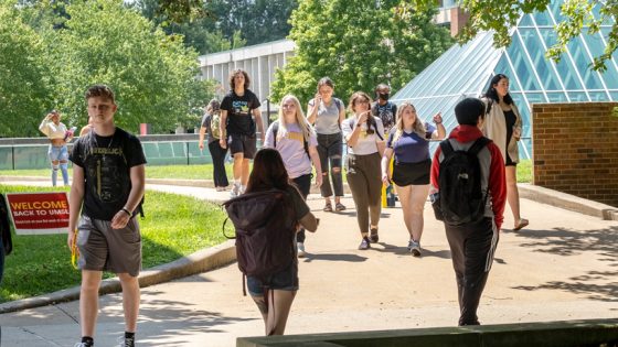 Students stroll past the Mercantile Library Pyramid and into the Quad on the first day of classes