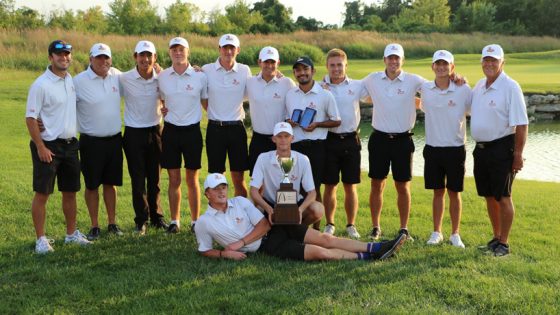 Players and coaches from the UMSL men's golf team pose with the Arch Cup