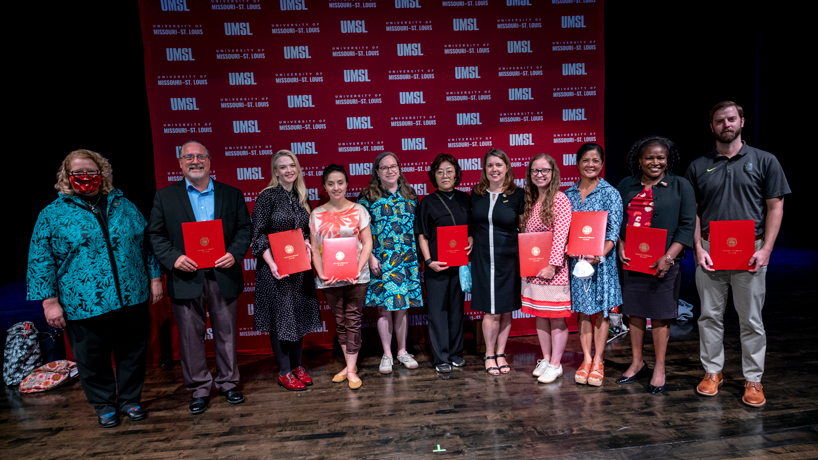 Chancellor Kristin Sobolik stands with 2022 recipients of the Chancellor's Awards for Excellence