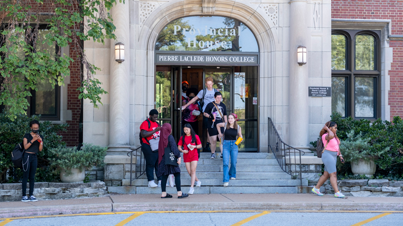 Students walk out of the Provincial House after finishing a late-afternoon class in the Pierre Laclede Honors College