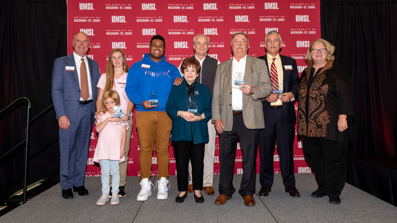 Peter Racen, Celsi Lyons and her daughter, Akeem Shannon, Maxine Clark, Dan Lauer, George Paz, Marc Bowers, Kristin Sobolik at the UMSL Accelerate Entrepreneur of the Year Awards